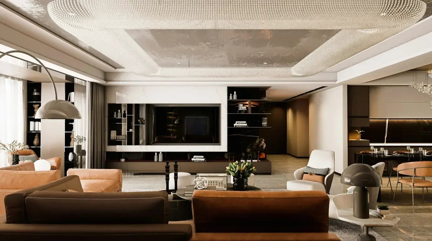 A furnished open-plan residence with a wall-mounted screen, dining table and lounge seating