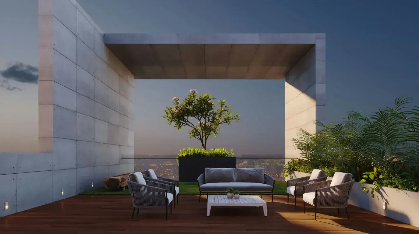 A walled courtyard terrace with a single tree in a planter and outdoor seating