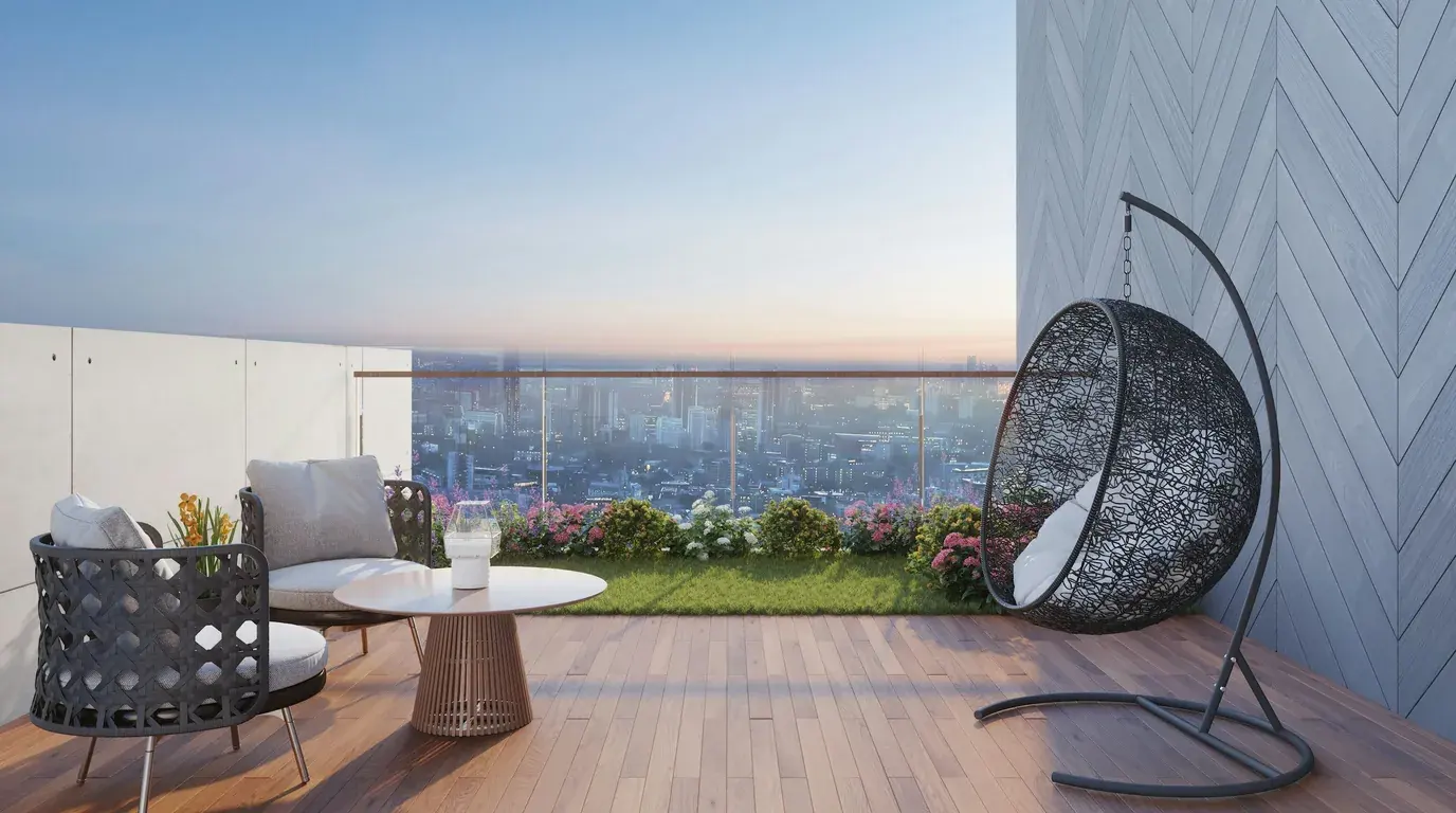 A high-rise terrace at dusk with woven armchairs and a hanging egg chair, the lit city below.
